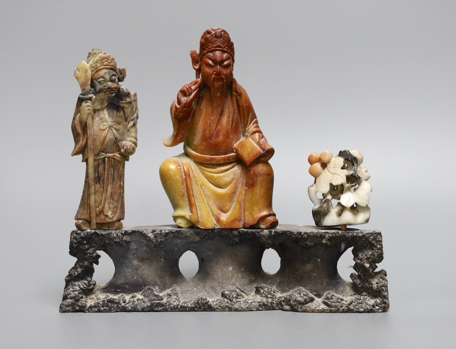 A Chinese soapstone deity figure group, 20cm wide